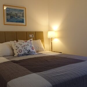 Double bed in bedroom at Premium Apartment