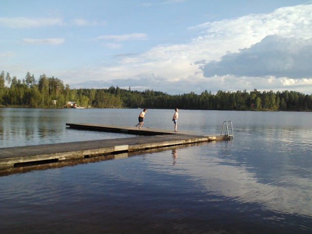 Warm evening bath at beach by the lake